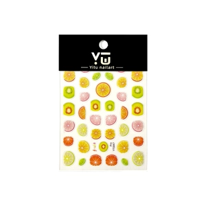 Colorful fruit slice nail art stickers with lemon and watermelon motifs on packaging