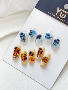 Detail of beach-themed nail stickers with sunset patterns and 3D pearl decorations