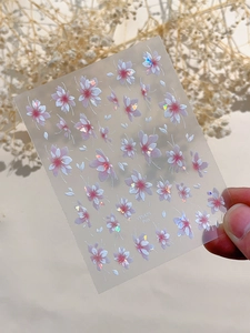 Detailed macro of pink and white shell-light cherry blossom nail art stickers