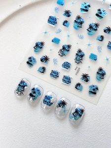 Detail view of summer beach nail stickers featuring palm trees and sea stars
