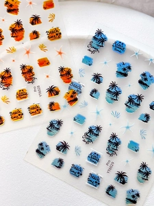 Detail of sunset beach nail stickers with palm tree silhouettes and sea star patterns