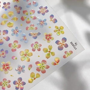 Iridescent aurora floral nail art stickers with colorful shell-like petals on white silk
