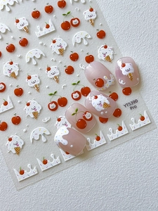 Detailed close-up of 3D embossed nail stickers featuring cherry and ice cream bear motifs