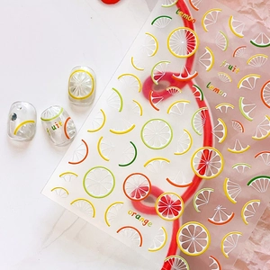 Summer lemon and orange fruit nail art stickers with colorful citrus designs for DIY manicures