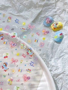Detail of colorful laser 3D nail stickers featuring cute dog, heart, and bow designs