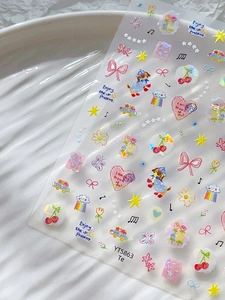 Detail of YT5863 nail stickers with laser heart, bow, and colorful dog patterns