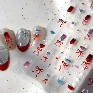 Chic 3D wine glass and red bow nail art stickers on silver and pink false nails