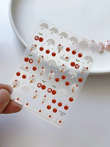 Close-up of YT5390 Pro nail stickers featuring cute cherry, cat, and crown patterns