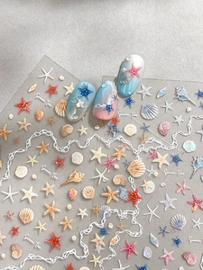 Detail of 3D shell and starfish nail stickers with pearlescent summer ocean theme