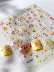 Detail view of cartoon little yellow duck and daisy embossed nail stickers YT5928