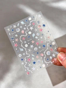 Detail of seashell and starfish nail art stickers with vibrant ocean theme designs