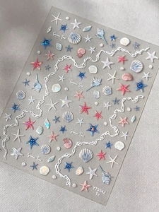 Detailed 3D embossed sea star and seashell nail art stickers in soft ocean blue and pearl pink