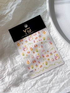 Detail of cute yellow duck and daisy nail art stickers with VU Yitu brand packaging