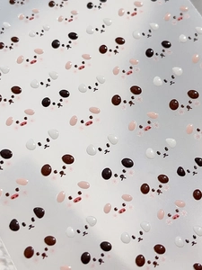 Macro detail of cute panda animal nail stickers with high-quality printing texture