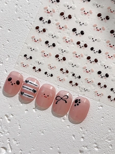 Detailed sheet of cartoon pig and panda nail stickers with cute 3D pink manicure effect