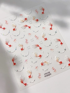 Close-up of 5D embossed koi fish nail art stickers with good luck text and pearls