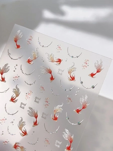 Detailed 5D relief nail stickers featuring koi fish and pearls with good luck text