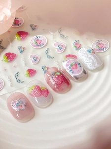 Detail of sweet strawberry and bow-knot nail stickers with embossed 3D texture