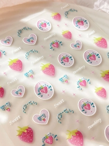 Detail of 3D embossed strawberry and bow nail art stickers with sweet heart patterns