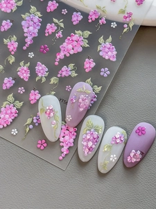 Detailed macro view of 5D embossed purple flower and green vine nail art stickers
