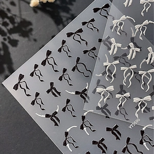 Autocollants 3D pour ongles avec motifs de nœuds papillon blancs et noirs pour nail art