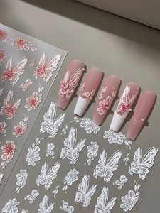 Detailed 3D embossed nail stickers featuring elegant pink and white butterfly floral patterns