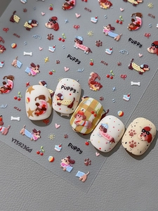 Detailed 3D embossed cartoon puppy nail stickers with cherry and heart motifs on gray leather