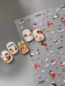 Detail of cartoon puppy and cherry nail stickers with 5 applied false nails on leather