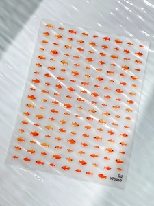 Macro detail of YT5969 orange jelly fish nail art stickers with cute cartoon sea patterns