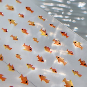 Cute gradient orange jellyfish and fish nail art stickers with glitter on water background