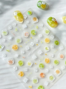 Detail of laser shimmer lemon and lime nail stickers with summer drink icons