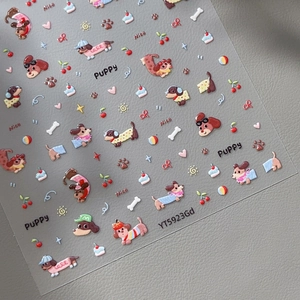 3D embossed nail stickers with cute puppy, cherry, and heart designs on a grey background