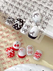 Detail of YT5605 embossed nail stickers with cherry, bow, and checkered patterns