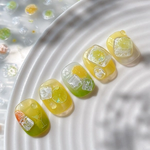 Summer lemon theme nail art stickers with 3D ice cubes and lime slices on white ceramic