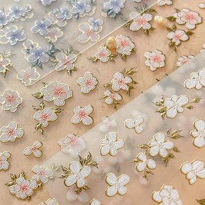 Exquisite 3D floral nail stickers with gold edges and delicate purple flower patterns