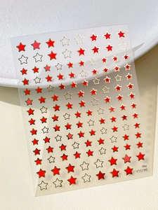 Macro detail of YT5790 gold-edged red star nail art decals on professional sheet