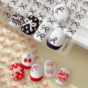 3D relief bow nail art stickers featuring red, black, and white patterns with silver French tips