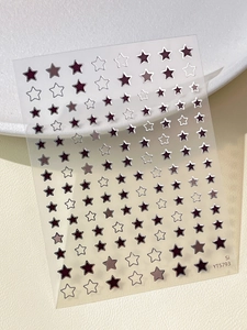 Detailed view of bronzing star nail art stickers with metallic gold and silver finish