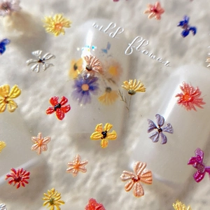 3D embossed wildflower nail stickers with colorful floral patterns and daisy designs