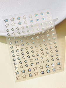Close-up of gold star nail art stickers YT5792 featuring light blue and gold designs