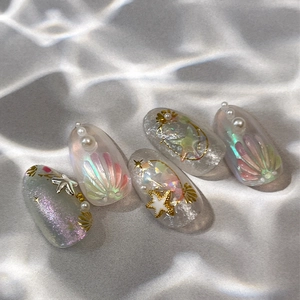 Sparkly ocean themed press-on nails with 3D sea stars pearls and shell textures