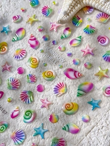 Detailed 5D embossed nail stickers featuring rainbow sea shells and starfish motifs