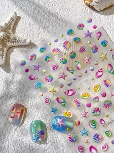 Detail of 3D embossed rainbow shell nail stickers with holographic starfish and sea motifs