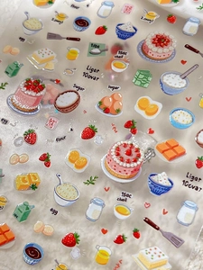 Close-up of embossed strawberry cake nail art stickers with baking and dessert motifs