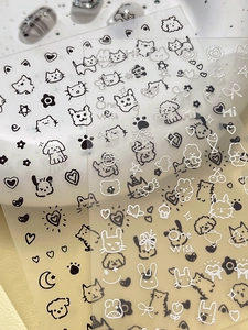 Détails d'autocollants nail art mignons noir et blanc avec motifs de lapin et de cœur