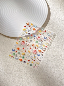Detailed close-up of cute strawberry cake and baking themed embossed nail art stickers