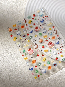 Close-up of strawberry cake nail art stickers featuring cute bakery and dessert designs