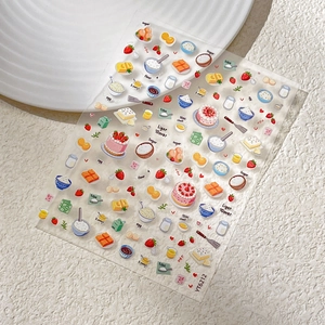 Cute strawberry cake nail art stickers featuring baking theme illustrations on a white tray