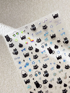 Detail view of cute black cat and musical note embossed 3D nail art stickers