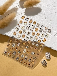 Close-up of embossed puppy nail art stickers YT6208 applied on artificial nails